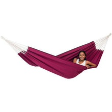 Load image into Gallery viewer, Person sitting in a purple hammock on a white background