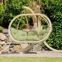 Load image into Gallery viewer, Globo Royal Oliva Double Seater Hanging Chair On A Stand Next To A Tavolino Table. 

